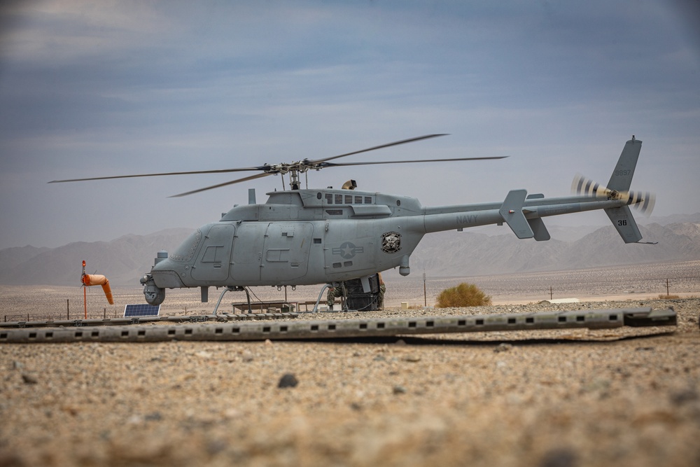 U.S. Navy MQ-8C Fire Scout first time ground refueling by U.S. Marine Corps CH-53E Super Stallion