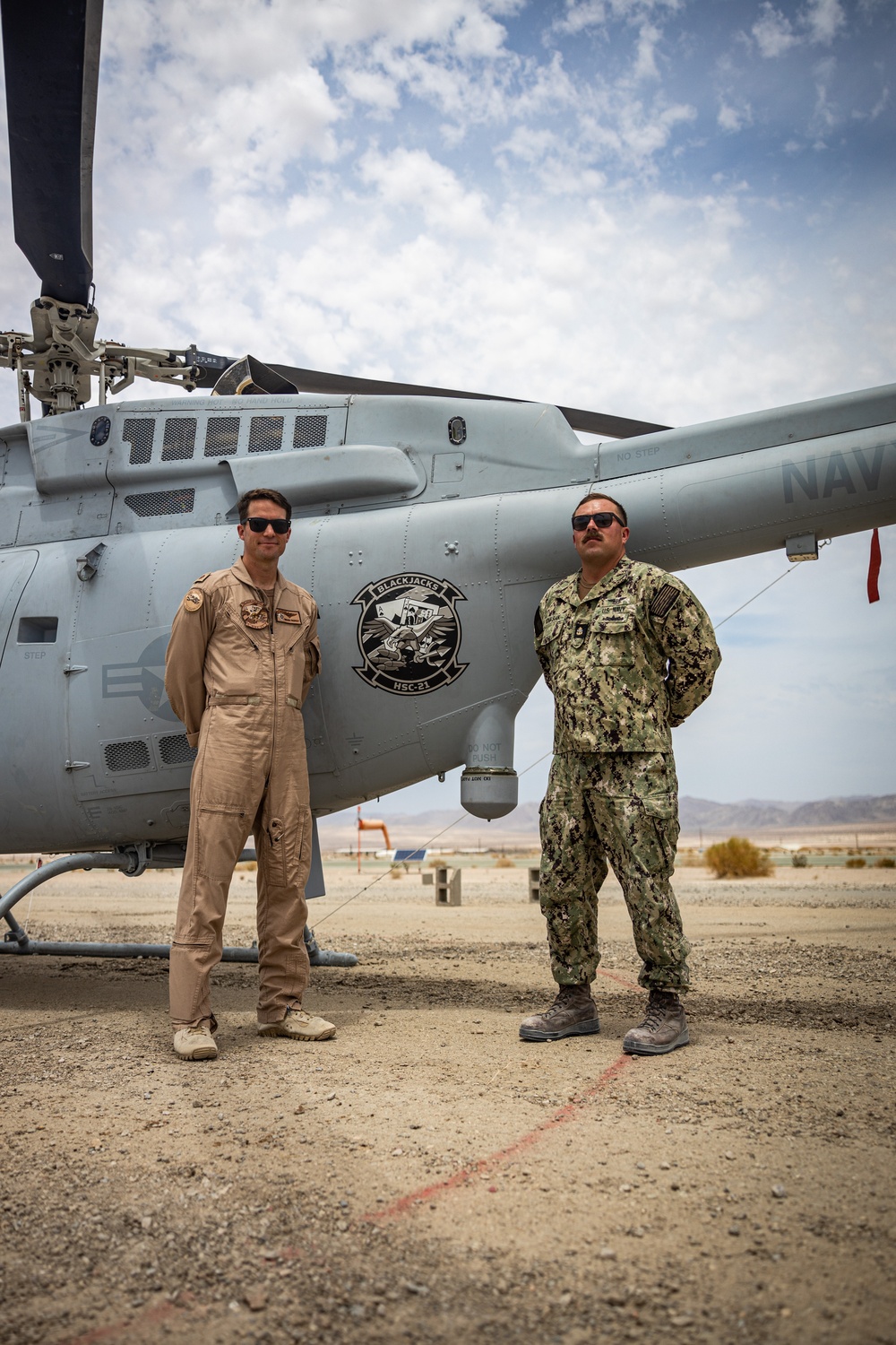 U.S. Navy MQ-8C Fire Scout first time ground refueling by U.S. Marine Corps CH-53E Super Stallion