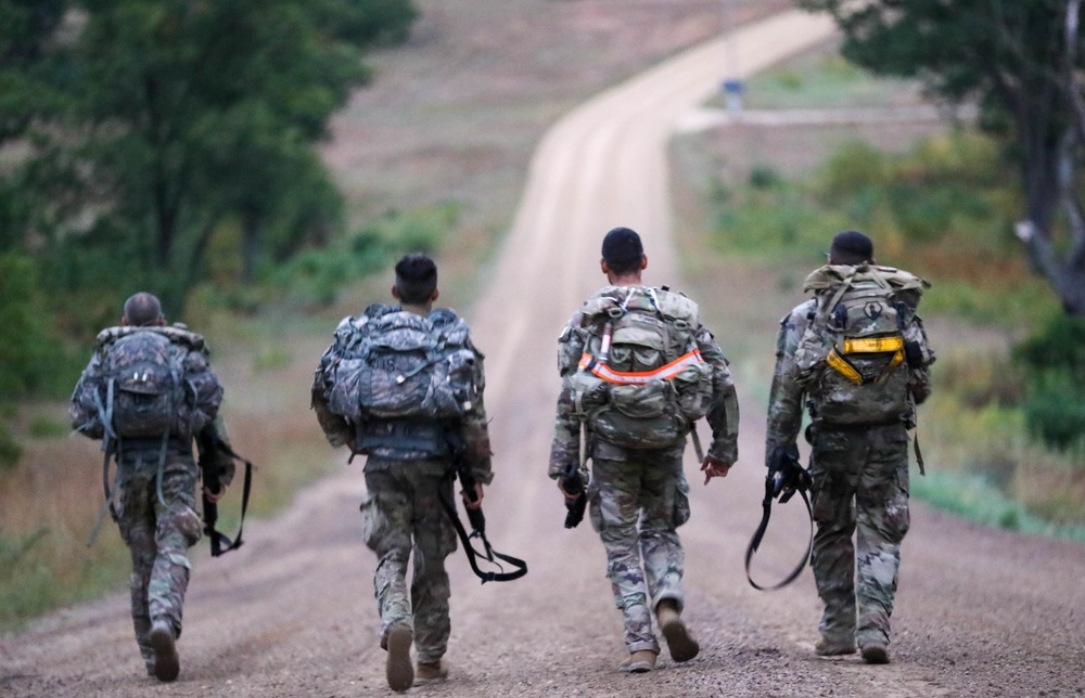 U.S. Army Reserve Best Squad Competitors participate in a 12-mile ruck march