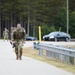 Spc. Coby Eckestein heads toward the finish line of a 12-mile ruck march