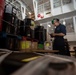 Sailor Accounts for Inventory in the Hangar Bay of USS Carl Vinson (CVN 70)