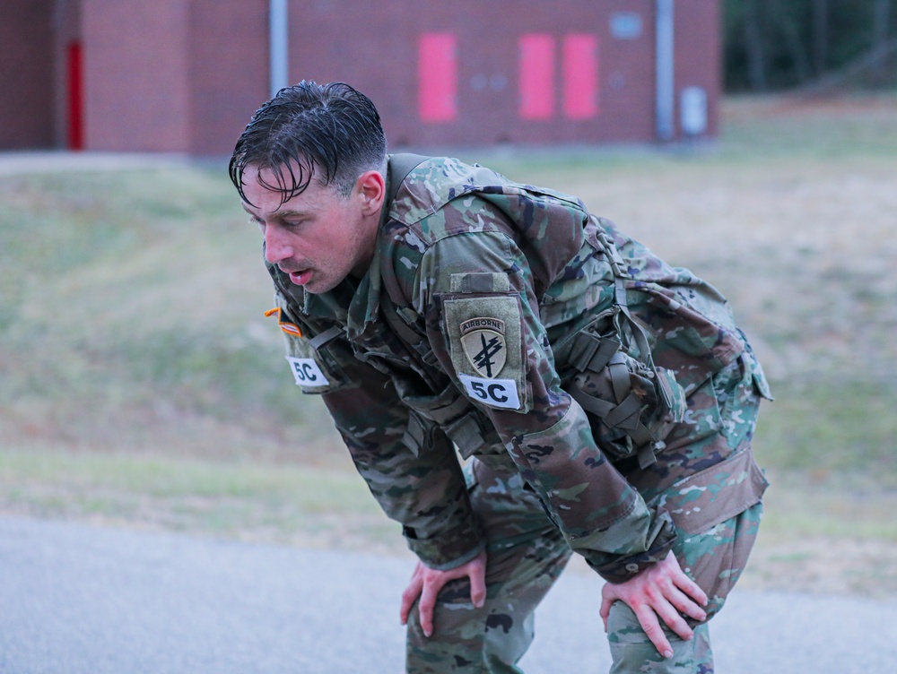 Spc. Matthew Dillion recovers after the 12 mile ruck march