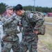 Spc. Stephan Mixter removes his rucksack after the 12 mile ruck