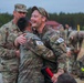 Sgt. Connor Housman and Spc. Hayse J. Jorgensen celebrate completing 12 mile ruck march.