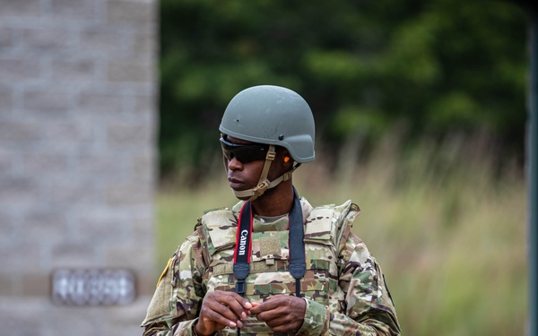 Spc. Edward Robinson scouts the M320 Grenade Launcher range
