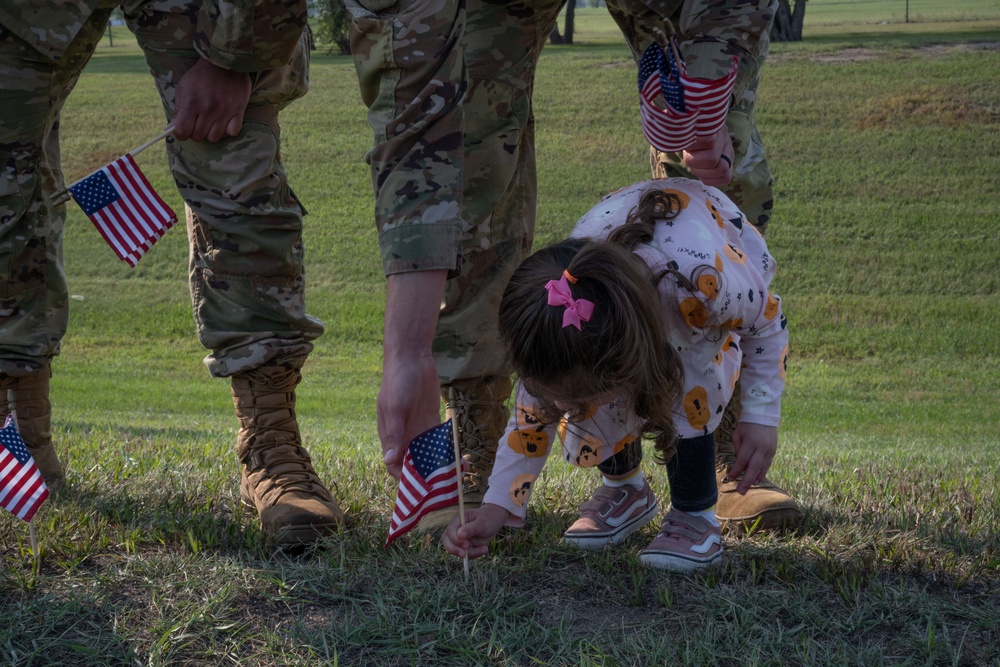 Airmen Place Flags in Remembrance of Those Lost to Suicide