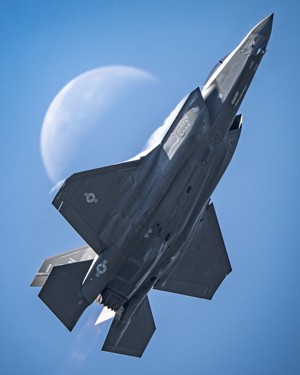 A F-35A Passes by the Moon During a Demonstration Over Belgium