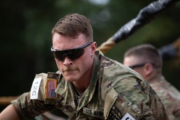 Cpl. Michael Glosemeyer traverses a rope obstacle