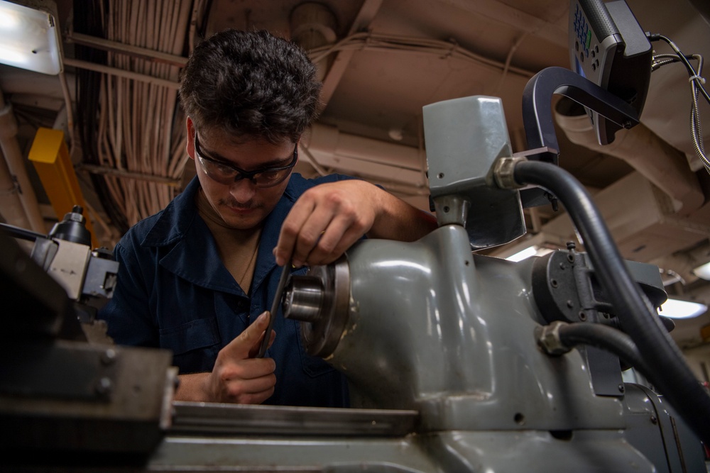 Sailor Conducts Maintenance