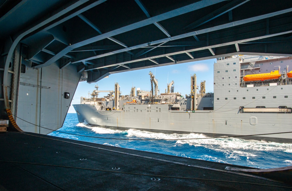 USNS Richard E. Byrd Steams Alongside The Aircraft Carrier USS Nimitz