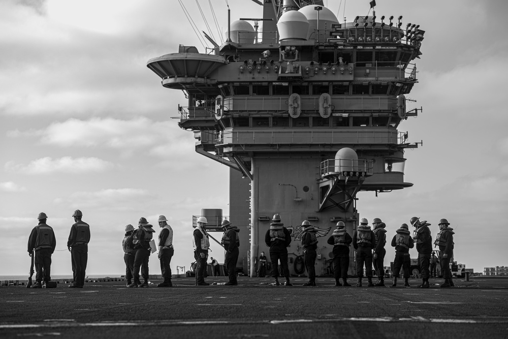 U.S. Navy Sailors Man A Phone And Distance Line