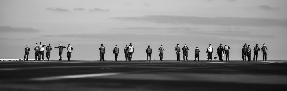 U.S. Navy Sailors Conduct A Foreign Object Debris Walk down