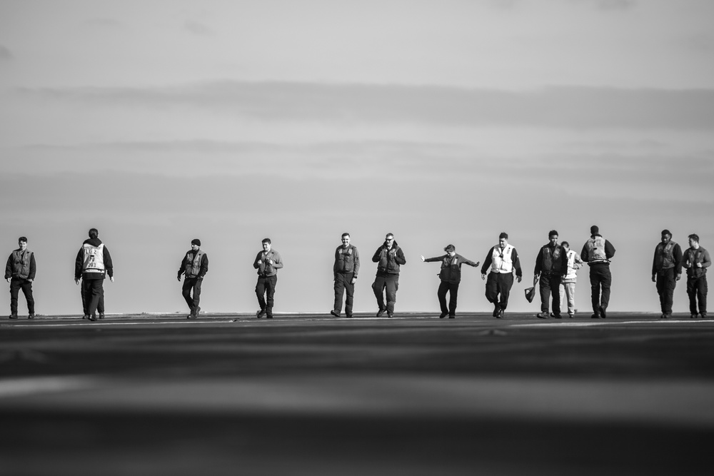 U.S. Navy Sailors Conduct A Foreign Object Debris Walk down