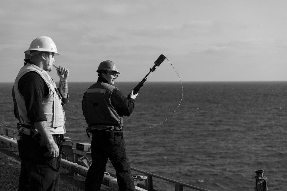 Sailor Prepares To Fire a Shot Line