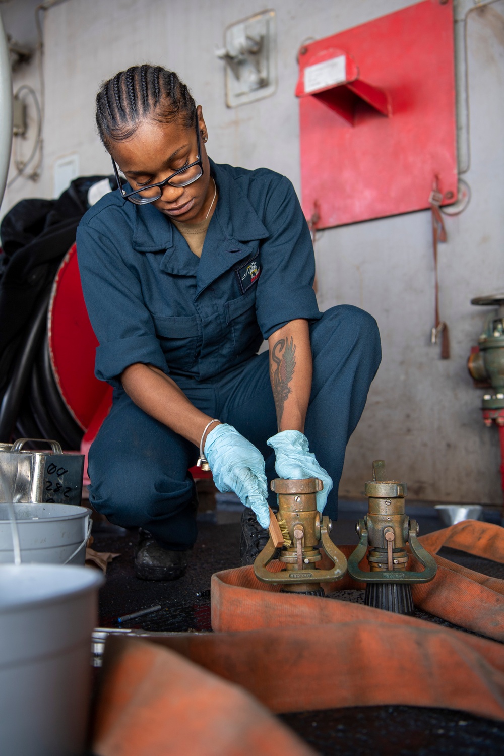 Sailor Conducts Maintenance