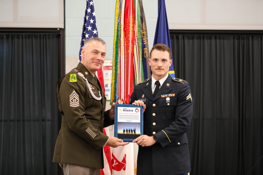 Command Sgt. Maj. Andrew Lombardo (left) presents the Expert Physical Fitness Assessment to Cpl. Michael Glosemeyer