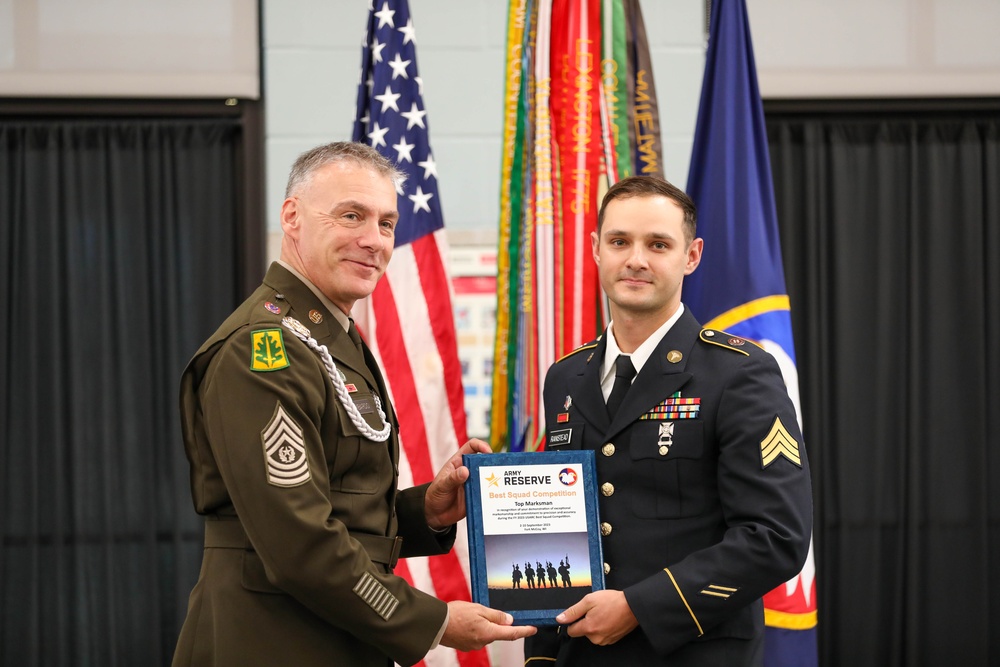 Command Sgt. Maj. Andrew Lombardo (left) presents the Army Reserve Best Squad Top Marksman award to Sgt. James Ranstead