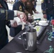 U.S. Army Reserve Best Squad cadre cuts the cake for the award ceremony