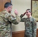 Airman Taylor Sula is promoted during drill weekend at the 182nd Airlift Wing