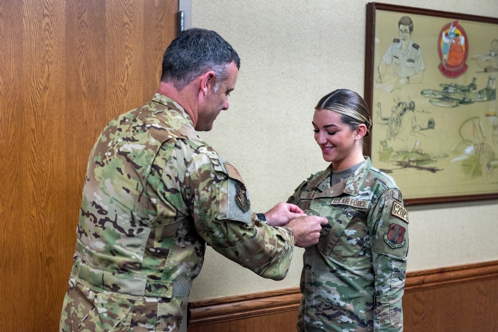 Airman Taylor Sula is promoted during drill weekend at the 182nd Airlift Wing