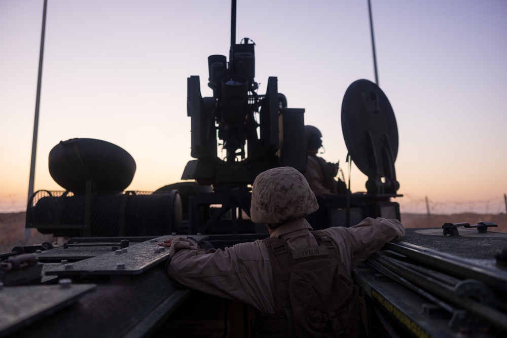 Marines with 3rd Assault Amphibian Bn. zero their weapons.