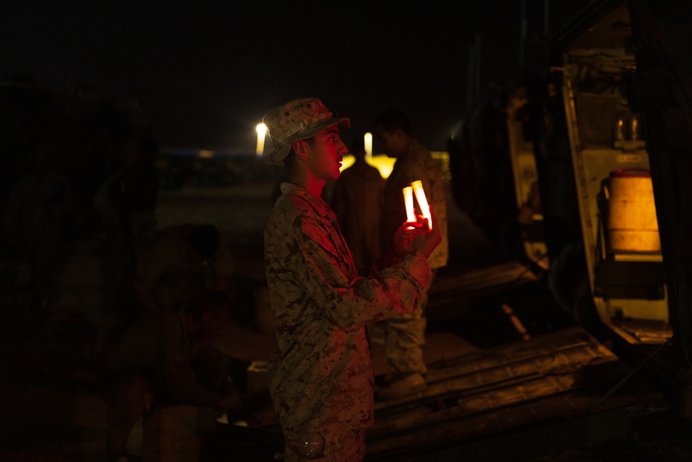 Marines with 3rd Assault Amphibian Bn. zero their weapons.