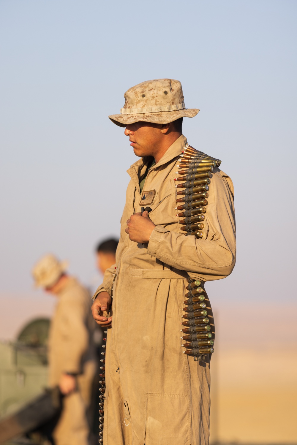 Marines with 3rd Assault Amphibian Bn. zero their weapons.