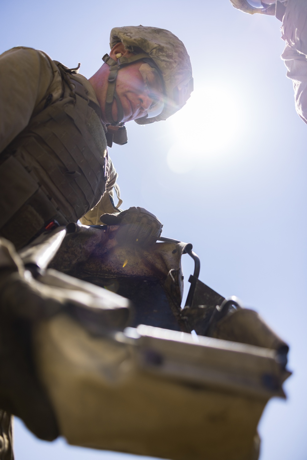 Marines with 3rd Assault Amphibian Bn. zero their weapons.