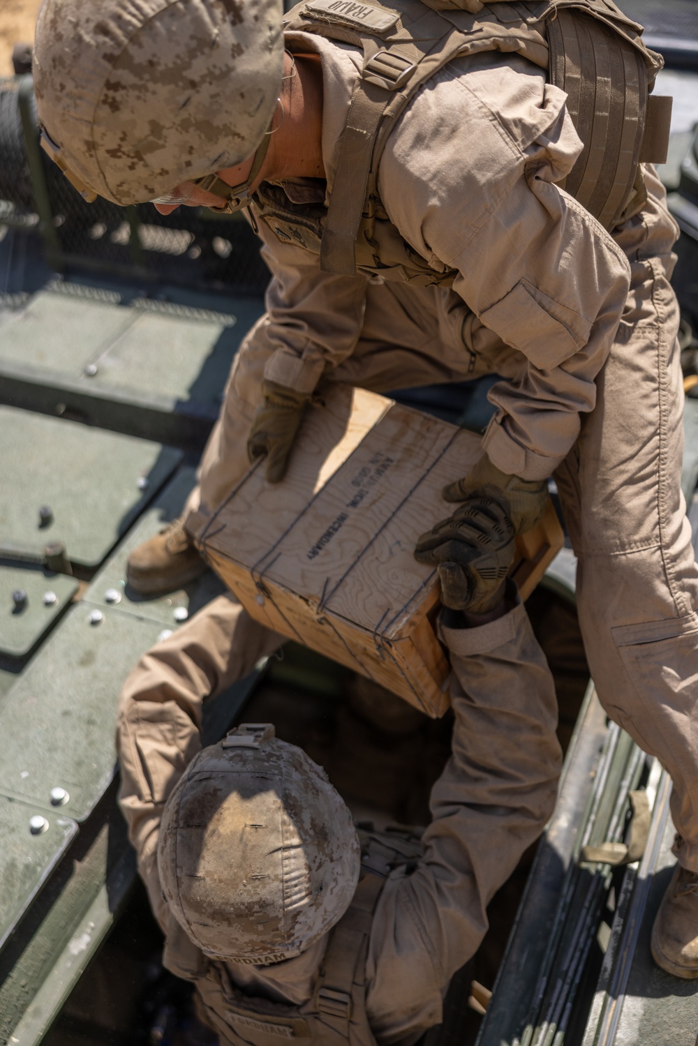 Marines with 3rd Assault Amphibian Bn. zero their weapons.