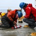 U.S. Coast Guardsmen conduct science operations