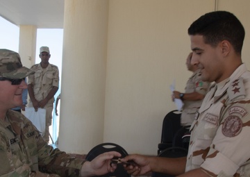 U.S. Army 1st Lt. Michael Needham, a unit public affairs representative for 1-155th Infantry, Task Force Reaper, trades patches with an Egyptian soldier, during exercise Bright Star 23