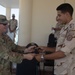 U.S. Army 1st Lt. Michael Needham, a unit public affairs representative for 1-155th Infantry, Task Force Reaper, trades patches with an Egyptian soldier, during exercise Bright Star 23