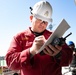 Makin Island Sailors and firefighters from Region Southwest Federal Fire Department participate in a simulated fire drill