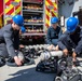 Makin Island Sailors and firefighters from Region Southwest Federal Fire Department participate in a simulated fire drill