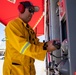 Makin Island Sailors and firefighters from Region Southwest Federal Fire Department participate in a simulated fire drill