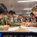 Sailors assigned to USS Makin Island participate in a Navy-wide advancement exam