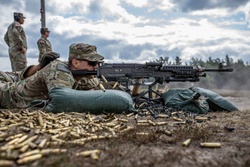 Spc. Peter Martin fires an M240 machine gun [Image 2 of 4]