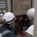 Keeping it Cool : Japanese Contractors on Marine Air Station Iwakuni repair air conditioning unit