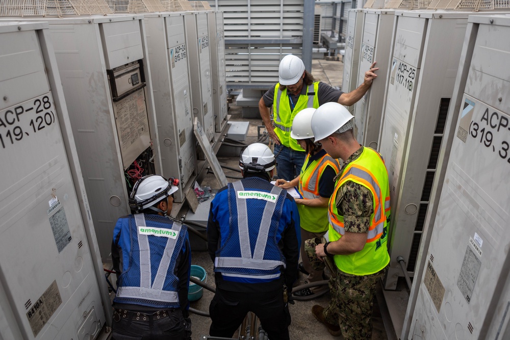 Keeping it Cool : Japanese Contractors on Marine Air Station Iwakuni repair air conditioning unit