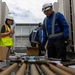 Keeping it Cool : Japanese Contractors on Marine Air Station Iwakuni repair air conditioning unit