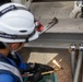 Keeping it Cool : Japanese Contractors on Marine Air Station Iwakuni repair air conditioning unit