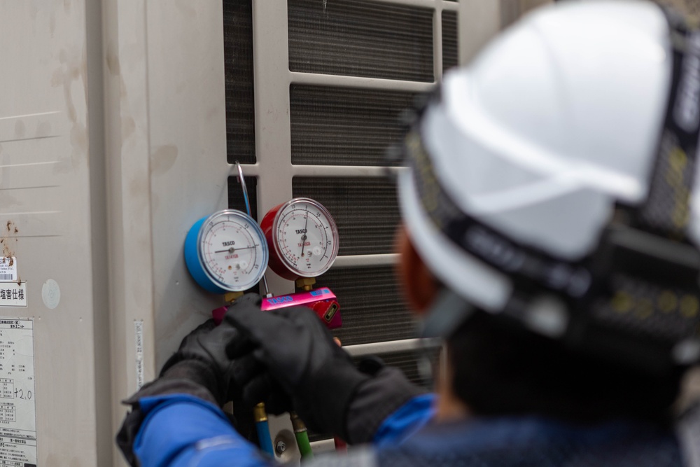 Keeping it Cool : Japanese Contractors on Marine Air Station Iwakuni repair air conditioning unit