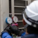 Keeping it Cool : Japanese Contractors on Marine Air Station Iwakuni repair air conditioning unit