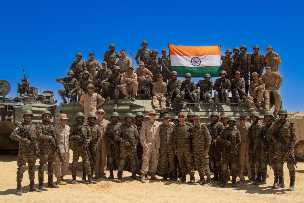 U.S. Marines celebrate the end of a live fire exercise with Indian Army soldiers