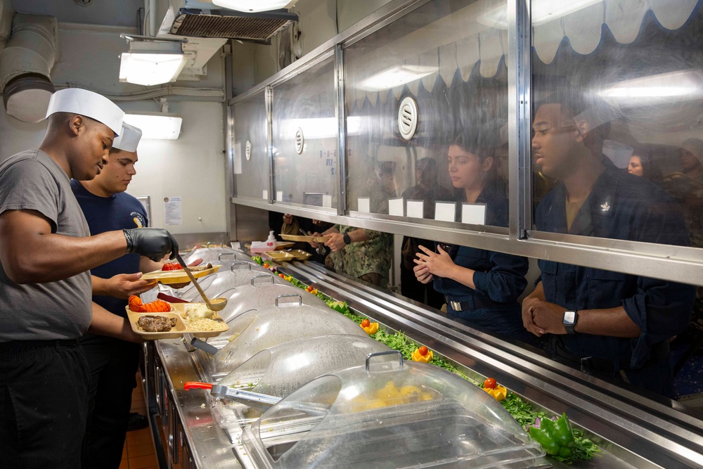 USS Abraham Lincoln serves lunch for the opening of the galley