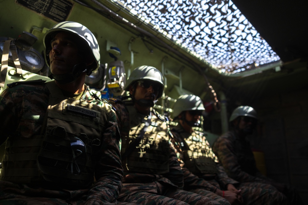 Marines with 3rd Assault Amphibian Bn. coordinate maneuvers with partner nations for upcoming combined arms live fire exercise