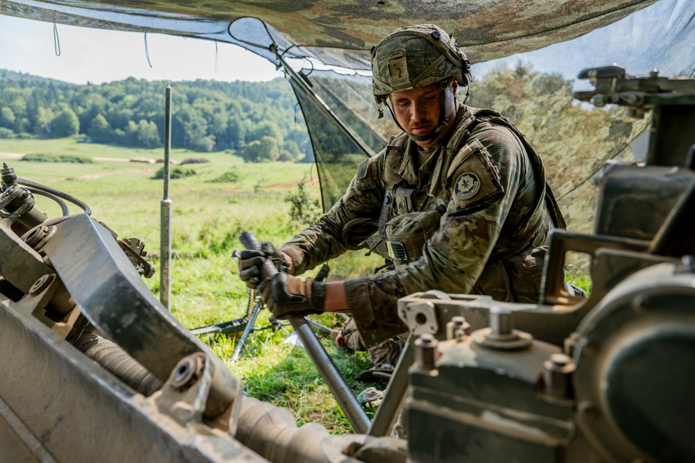 Field artillery crews set up positions at Saber Junction 23