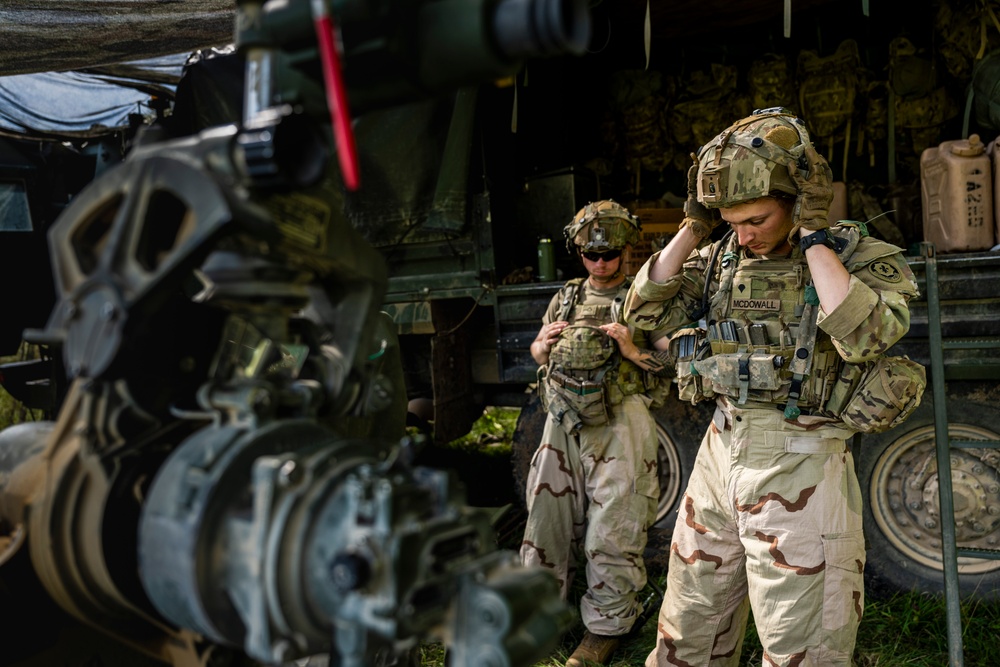 Field artillery crews set up positions at Saber Junction 23