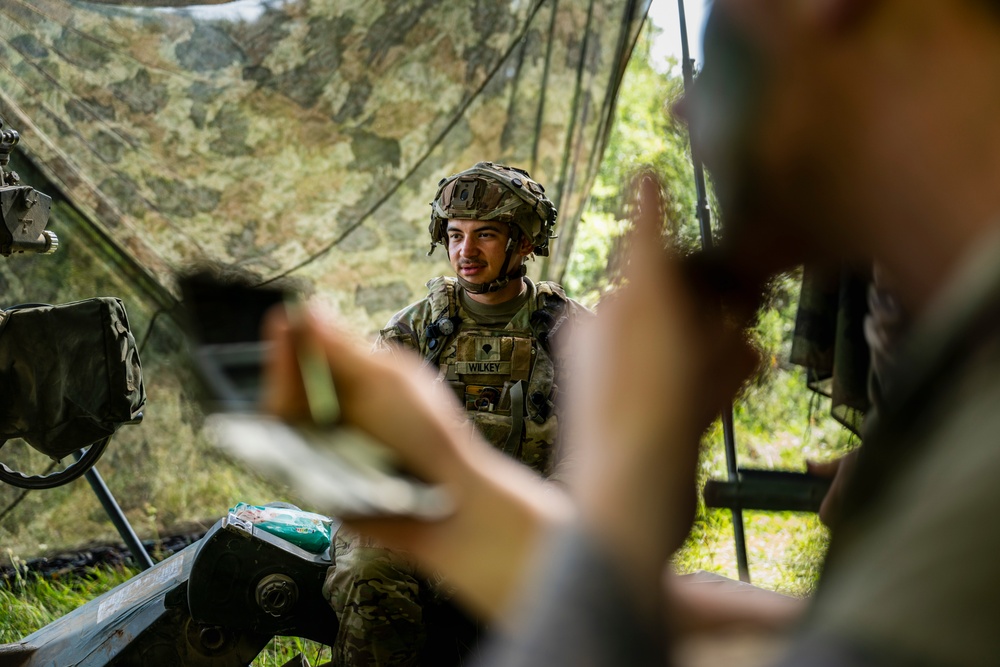 Field artillery crews set up positions at Saber Junction 23