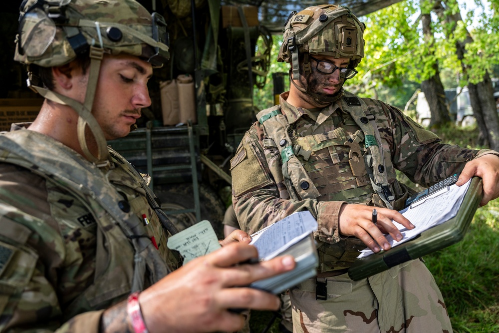 Field artillery crews set up positions at Saber Junction 23